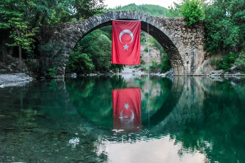 a flag from a rope over a body of water